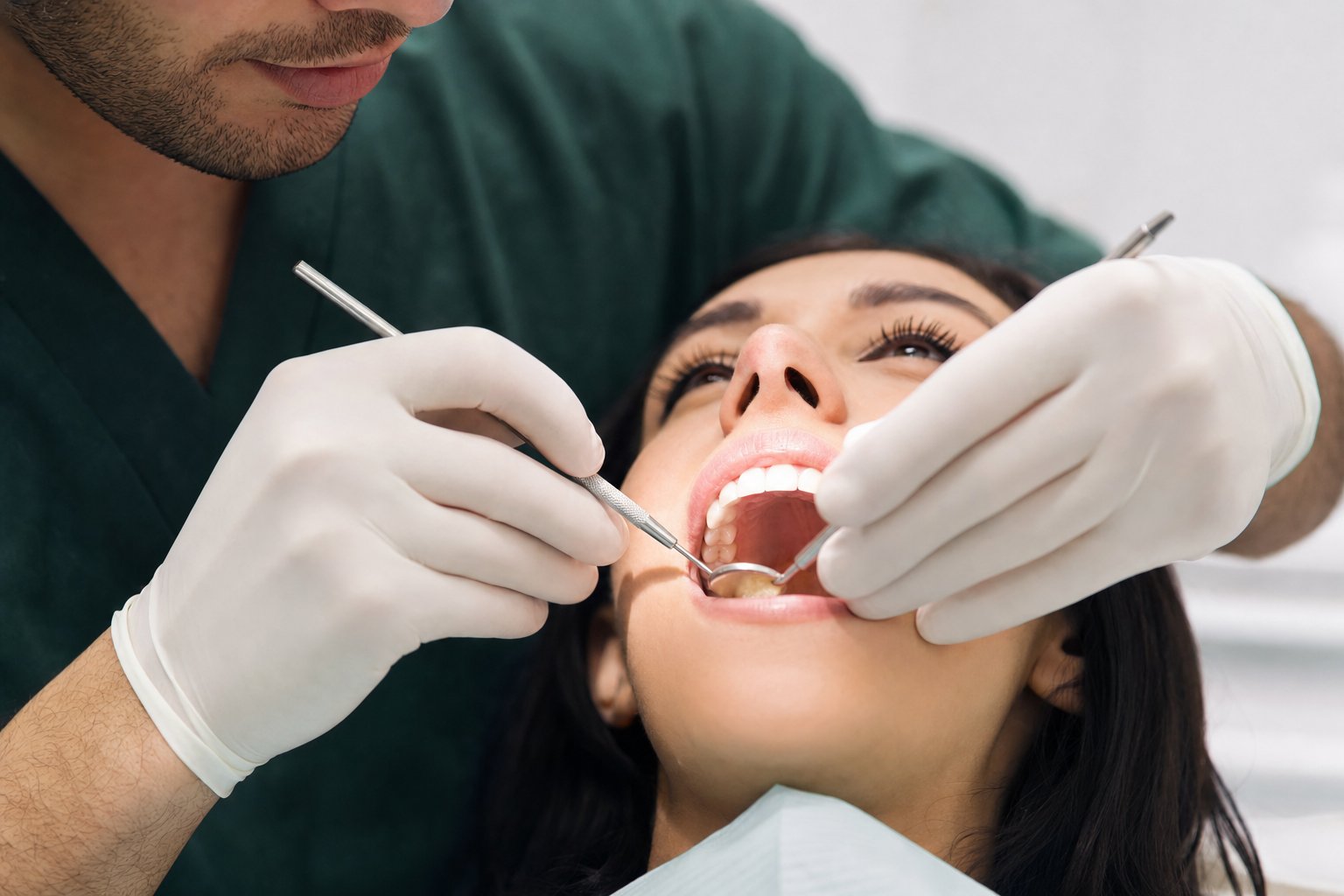 Dentist carefully treating a patient’s tooth